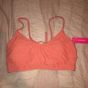 sparkly salmon colored swimsuit top.